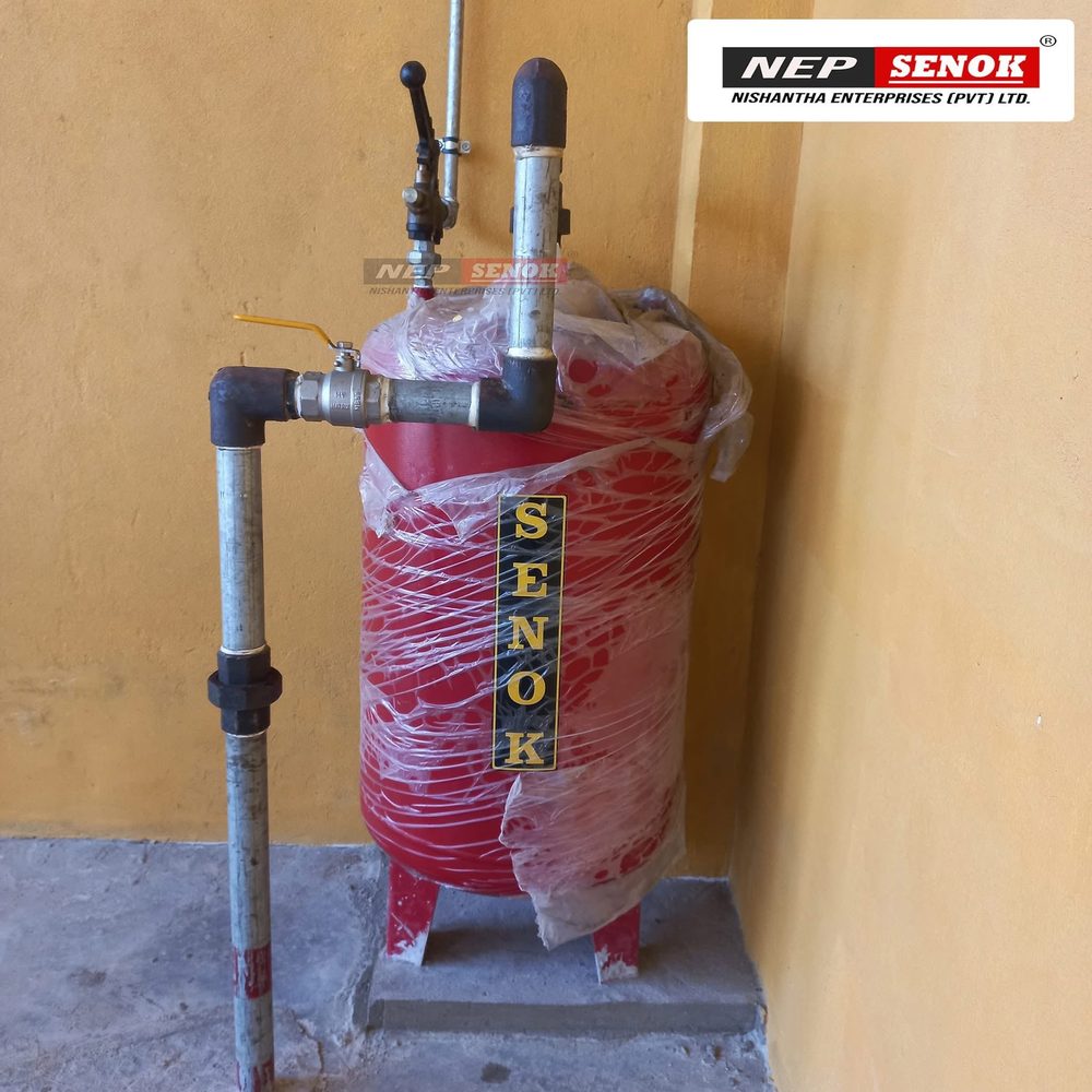 Senok air receiver tank installed and piped against a wall