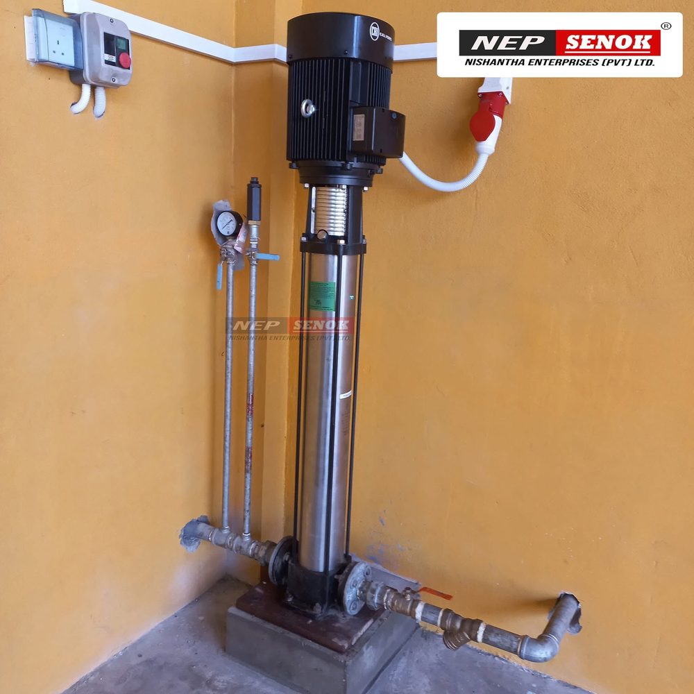 Vertical multistage booster pump mounted on a plinth with gauge and three-phase supply