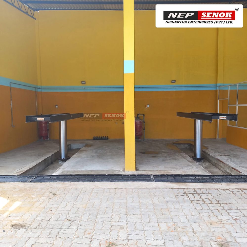 Two single-plunger washing jacks installed in a commissioned two-bay wash centre